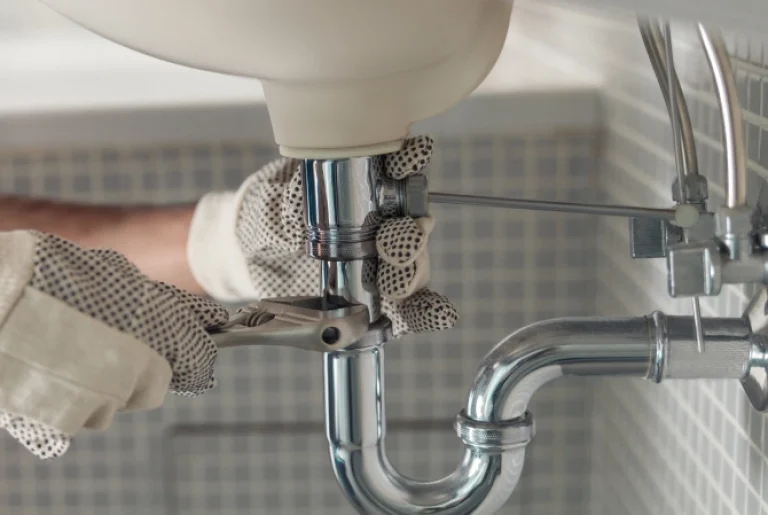 A plumber repair sink